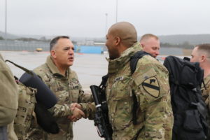 Maj. Gen. Paul T. Calvert, 1st Cavalry Division commanding general, shakes hands of First Team Troopers from the division headquarters on Feb. 10, 2019 as they depart Fort Hood for their deployment to Kandahar, Afghanistan.