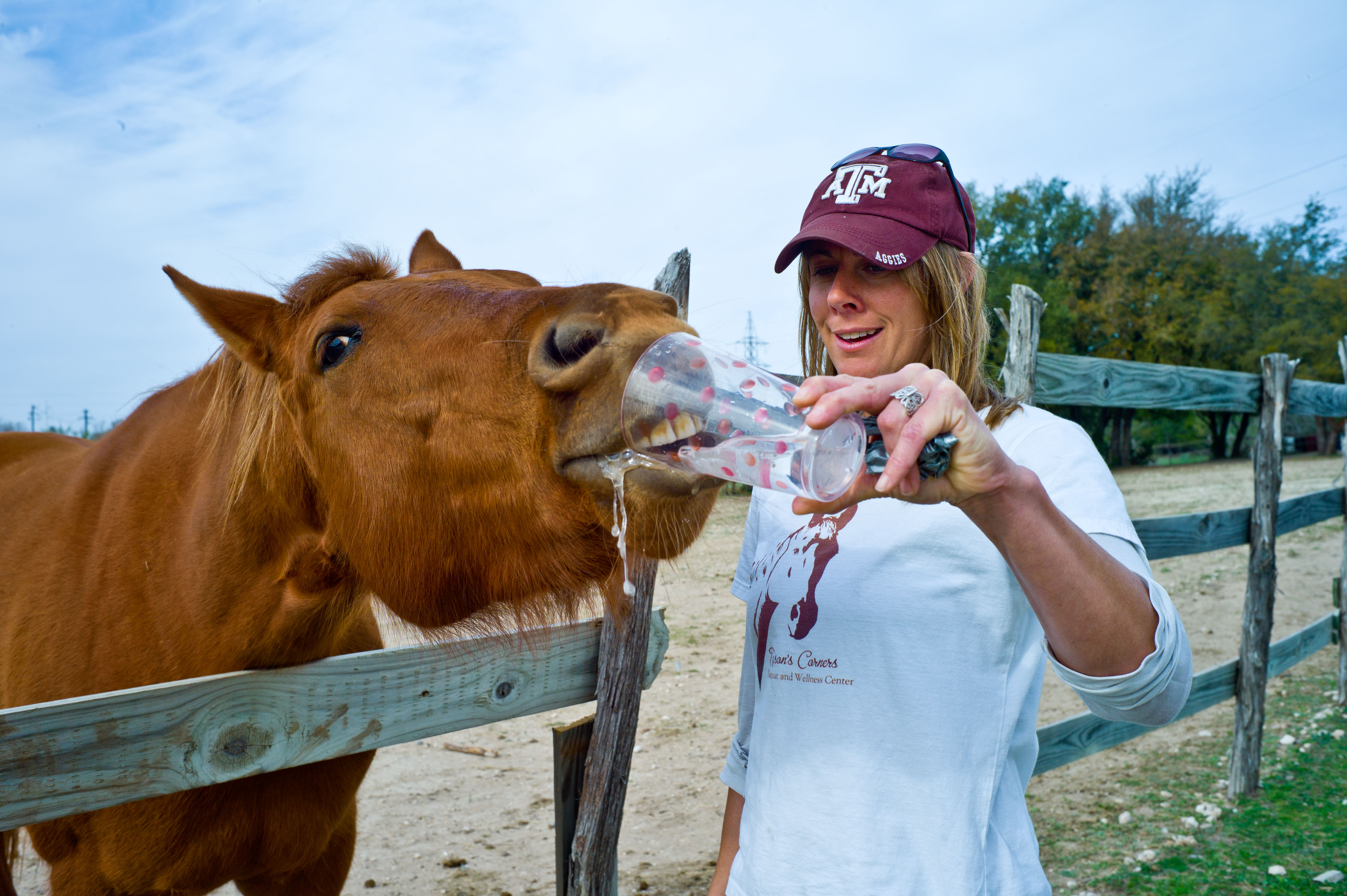 Joanna Tyson, an equine specialist, shares a glass of water with her friend “PJ” during a single Soldier retreat held March 1-3 at Tyson’s Corner Retreat and Wellness Center in Lampasas, TX. (Photo by Staff Sgt. Michael J. Dator, 85th Civil Affairs Brigade Public Affairs)