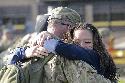 1st Sgt. James Funk, 1st Sgt. of Operations Company, Headquarters and Headquarters Battalion, 1st Cav. Div., embraces his daughter, April 6, at Cooper’s Field, after returning from a year deployment to Afghanistan in support of OEF XII.