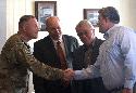 Brig. Gen. Michael Bills (left), commander of the 1st Cavalry Division, greets board members of the Greater Killeen Chamber of Commerce in Killeen, Texas, May 20. Bills met with the board members to discuss the division’s mission overseas and here at Fort Hood.